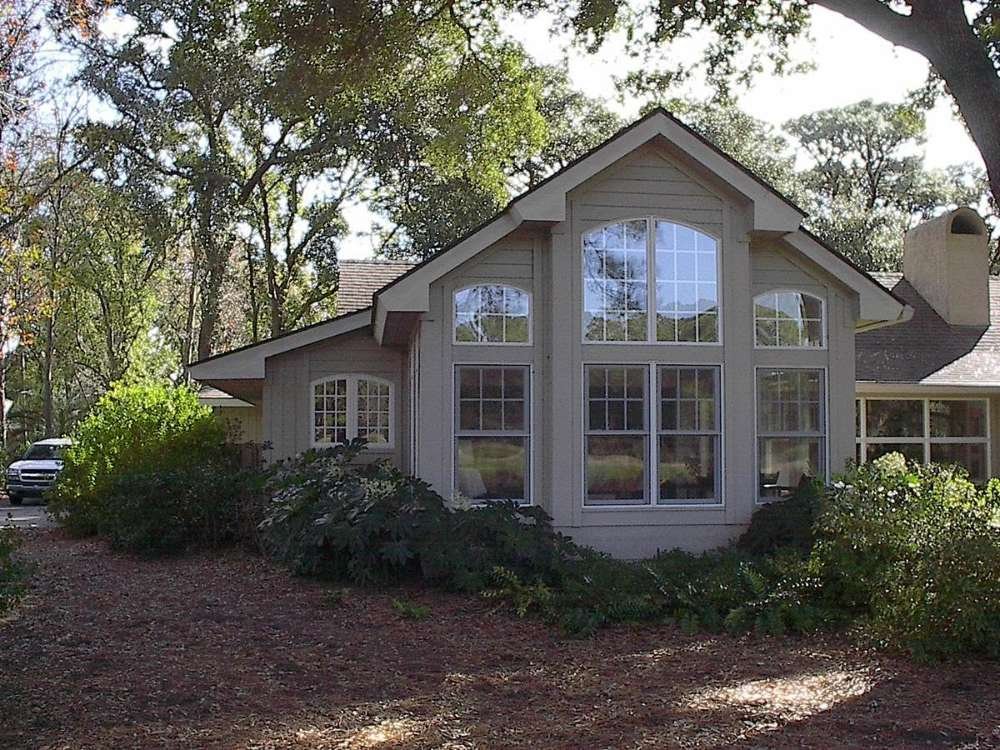 Home addition with gabled roof and horizontal siding by Burson Construction, Bluffton SC