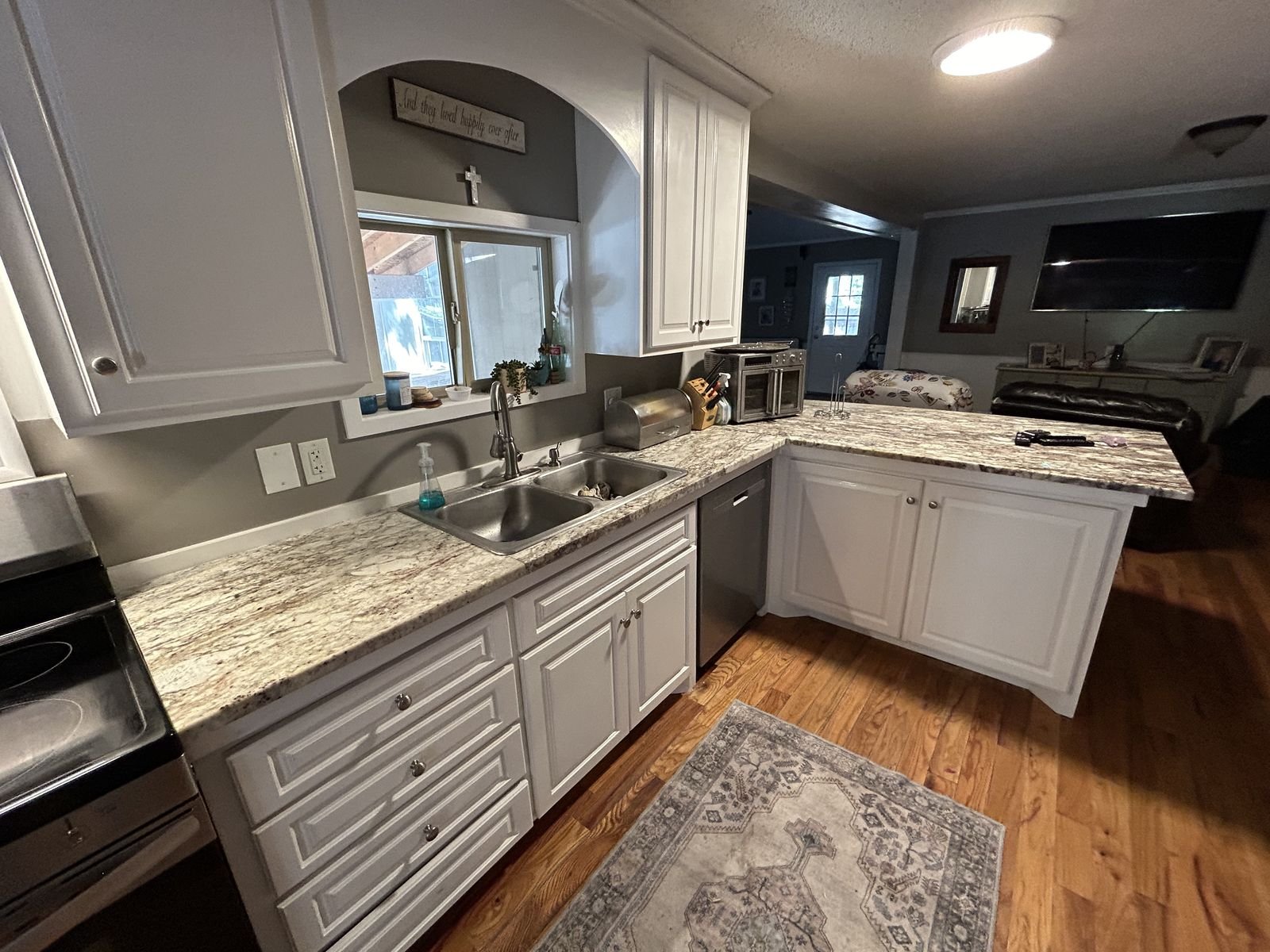 Kitchen remodel with white cabinets and granite countertops by Burson Construction, Bluffton SC