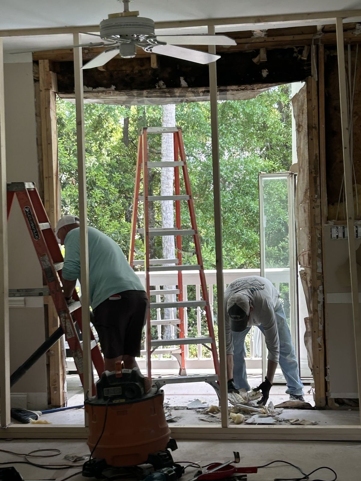 Crew rebuilding a window wall during an interior remodel by Burson Construction, Bluffton SC